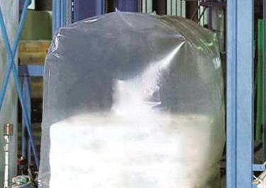 Bulk bag filling system - Covering of the bag