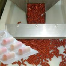 Mechanische overbrenging van farmaceutische capsules Mechanische overbrenging van farmaceutische capsules