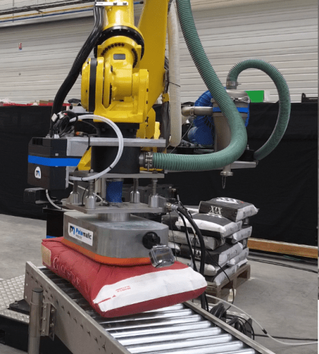Placing bags on roller conveyor