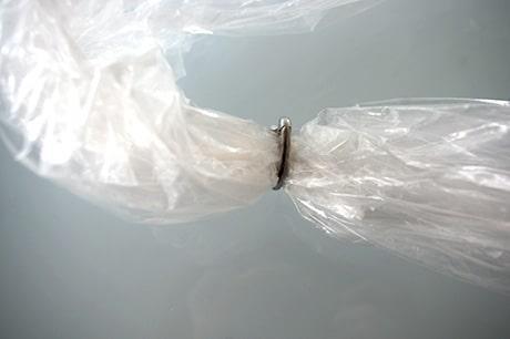 Clip on bag in barrel