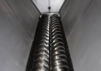 screw conveyor under industrial mixer